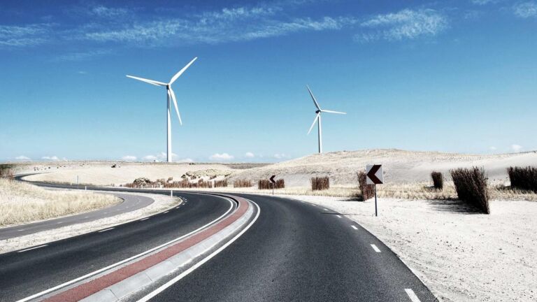 Wind turbines beside a road
