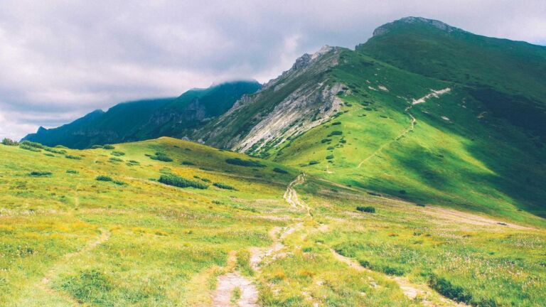 Green hills under a blue sky